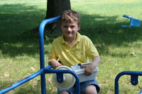Picture of a child on outdoor playground equipment